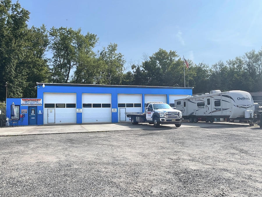 Koches main building with tow truck and camper out front