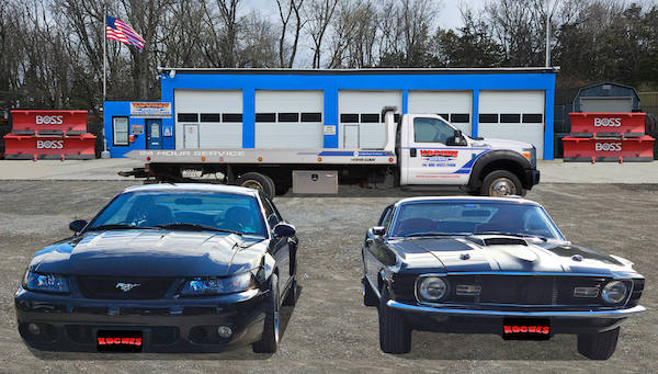 Koches auto repair shop with cars, a tow truck, and Boss snowplows